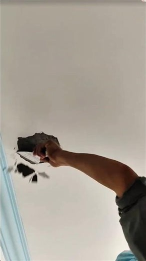 Repairing damaged ceiling with plaster for a smooth and seamless finish