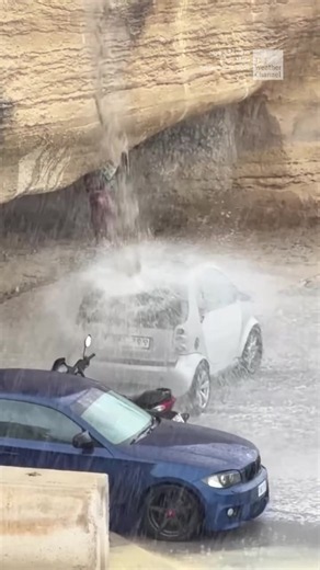 An unlucky driver in Malta may have picked the worst spot to park their car after the region saw its first rain in months.