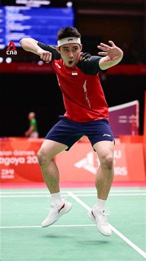 Singapore's Loh Kean Yew dances after beating Indonesian world number 1 Christie in Asian Games