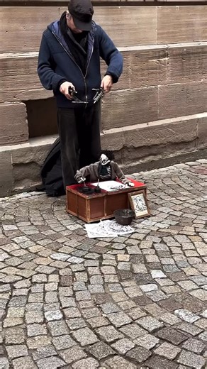 An Artist of Artists in Amsterdam. The way the puppet looks at the woman being touched by his work and offering a token of her appreciation. It touches my heart how an artist can make a puppet feel so much | Paola Luther Art