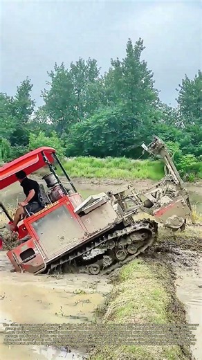 Traversing Field Ridges: Tracked Farm Tiller Crosses Earthen Berms To Cultivate Separate Paddy Plots