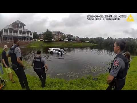 Rescuers Form Human Chain To Rescue Woman Trapped In Car In Pond