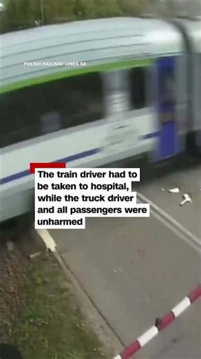 Train smashes into truck caught between crossing barriers