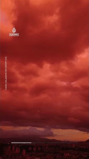 Venezuelan sky turns deep red as sun sets over Caracas