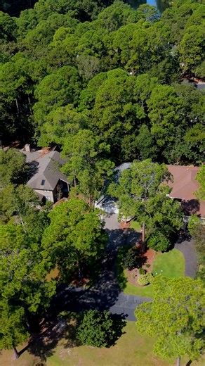 Upgraded Lowcountry home with lagoon views, sunroom, custom firepit, & resort amenities in Rose Hill Plantation! Tour today.