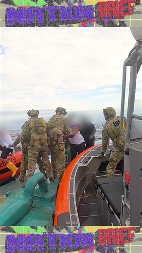 U.S. Coast Guard crew board a semi-submersible drug smuggling vessel