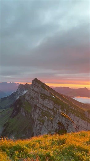 Person is filming their view and an amazing sunset from the top of the Schibenstoll!