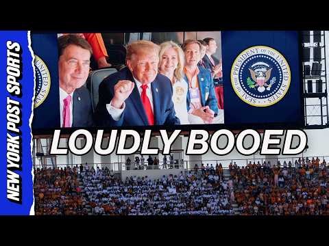 Donald Trump waves to jumbotron at Texas-Tennessee game