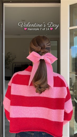 An easy ponytail with a romantic twist for love month 💖 Clip the top half of your hair out of the way, then pull the bottom section into a ponytail and secure. Release the top and create a simple Dutch braid, tying it off once you reach the ponytail elastic. Gently open a stitch near the end of the braid and slip the ponytail through, then softly tug the braid for that romantic, lived-in fullness. Finish with a bow or ribbon for the sweetest Valentine’s touch 🎀 @leletny bow #hair #hairtutorial