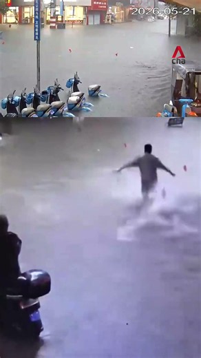Woman in China saved by neighbours after falling in floodwater