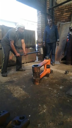 THOR'S POWER IN THROWING HEAVY MANUAL HAMMER DURING EXCAVATOR'S END BOSS REPAIR