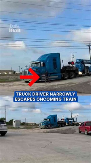 Freight train collides with truck as driver escapes in time