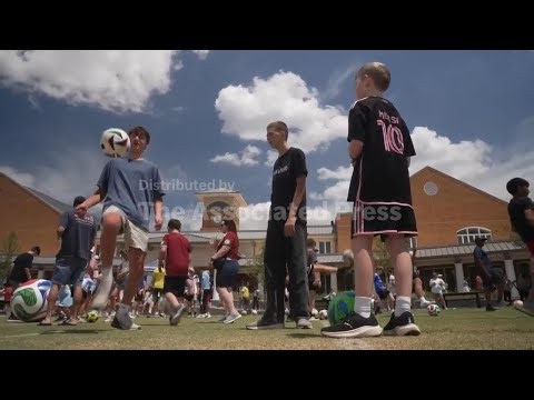 World Cup enthusiasts attempt world record for most people juggling soccer ball simultaneously