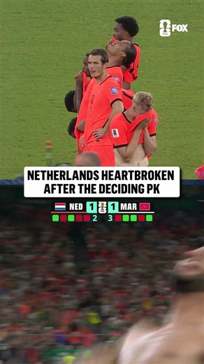 Netherlands players react to Morocco's winning penalty