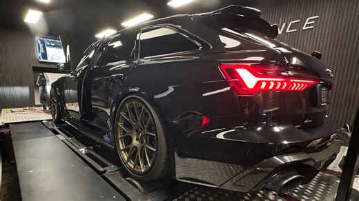 Audi RS6 C8 on a dyno test inside a tuning workshop