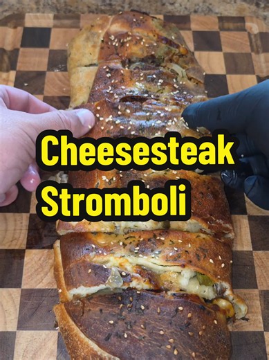 Philly Cheesesteak Stromboli Ingredients: 1 Pizza Crust Half an onion 1 Green bell pepper 8 oz mozzarella cheese 12 slices provolone Butter Sesame seeds Parsley 1lb shaved beef salt pepper garlic lawrys #phillycheesesteak #stromboli #cheesesteak