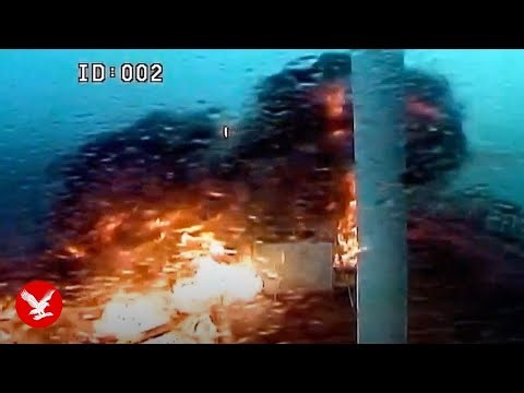 Moment two ships explode in huge fireball after deadly collision