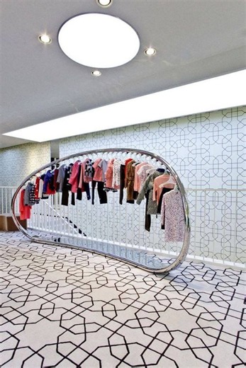 Unique clothing display | Marni store, Textile retail store design, Minimal luxe printed blouses