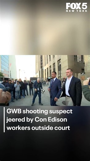 Victor Romero, charged with murder in the second degree in connection to the GWB shooting, is jeered by Con Ed workers outside court.