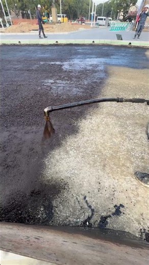 Spraying liquid tar! 🏗️💦 #shorts