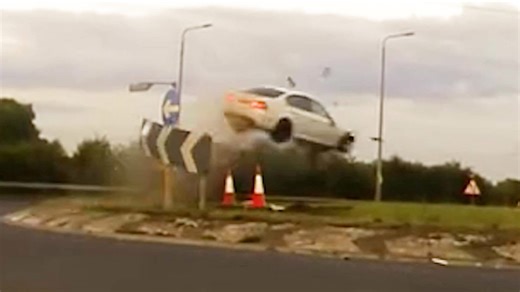 Drug driver flips car after 140mph police chase ends in airborne roundabout crash