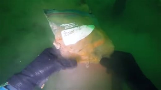 He dove under a water playground and found the camera everyone forgot about