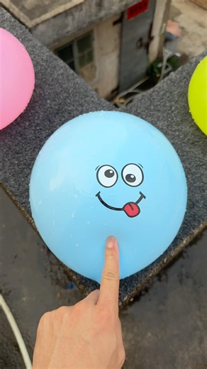 Experiment: Will a water balloon explode if it rolls down a tall building? 💥🎈 #balloon