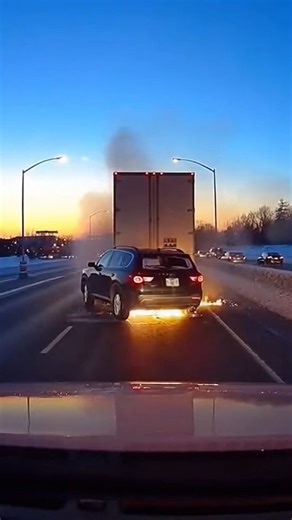 SUV Erupts in Massive Highway Explosion Chicago, Illinois — October 14, 2024 A terrifying scene unfolded on a busy interstate during rush hour when a mid-sized SUV suddenly caught fire and exploded, sending a massive fireball into the air. The incident, which occurred amidst heavy semi-truck traffic, left nearby drivers scrambling to safety as debris rained down across multiple lanes of the highway. Dashcam footage captured the tense moments leading up to the blast. As the dark SUV traveled betw
