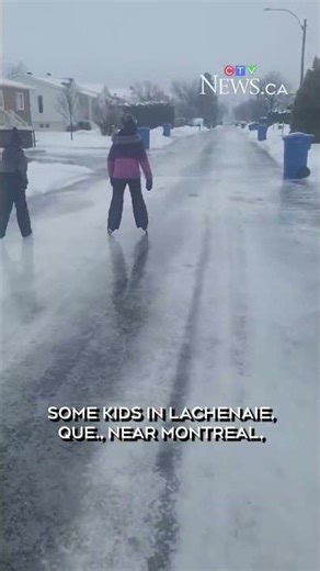 Children near Montreal skate on frozen street covered in ice