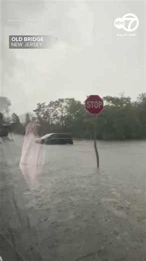 Drivers plow through several inches of flood water in Old Bridge, NJ
