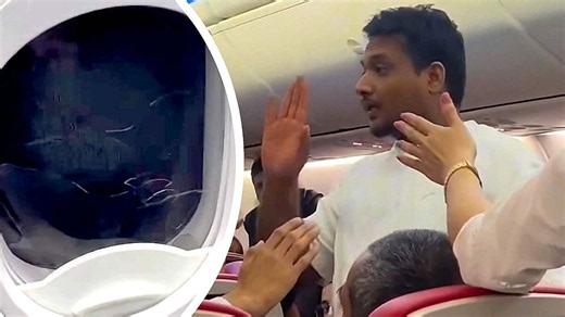 Passenger smashes emergency exit window and tries to open door mid-flight