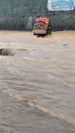 Flash Flood Sweeps Away Street Vendor's Cart