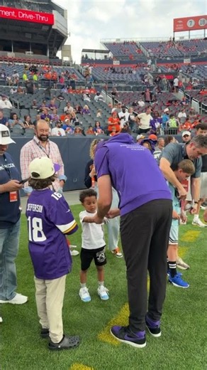 Kevin O'Connell on the field before Broncos game