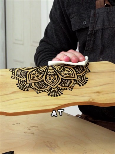 Handmade Serving Board in Less Than 10 Minutes 🔥 I sanded the pine until it felt smooth, then added pretreatment to avoid bleeding. Next, I placed a mandala stencil off the edge - just enough to give the board a unique look. I scraped Scorch Paint across the stencil, used a brayer to remove the extra, and heated it until the design turned a rich brown. Then I finished it with our food-safe finishing oil to protect the surface and bring out the grain. And when I held the finished board, it just 