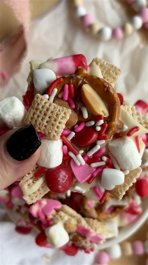SAVE THIS - Valentine’s Chex Mix is officially on repeat over here ✨💕 Sweet, crunchy, and dangerously snackable—perfect for movie nights, classroom treats, or sneaking from the pantry when no one’s looking. 🩷 Ingredients: * 4 cups Chex cereal * 12 oz white almond bark * 1 cup salted peanuts * ½ cup mini marshmallows * ½ cup mini pretzels * ½ cup valentine candy corn * ¼ cup red m&ms * 2 Tbsp festive sprinkles Instructions: 1. Prepare a cookie sheet with parchment paper. 2. Spread the Chex cere
