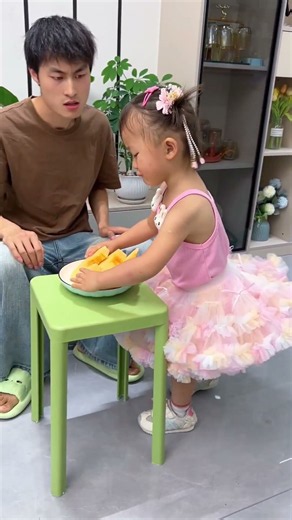 A clever kid shares fruit!
