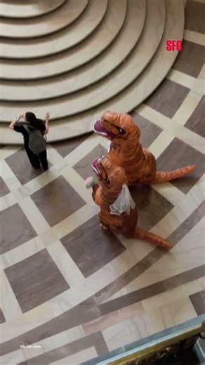 Dinosaur newlyweds turn heads at SF City Hall