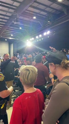 Protestor is taken out of the Trump rally in Sioux Gateway Airport in Iowa Thursday October 22 2026