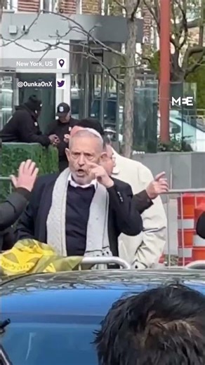 Elderly Zionist Protester Makes Throat-Cutting Gesture towards Pro-Palestinian protesters