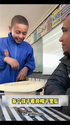 The children were laughing while looking inside their hats in the classroom.