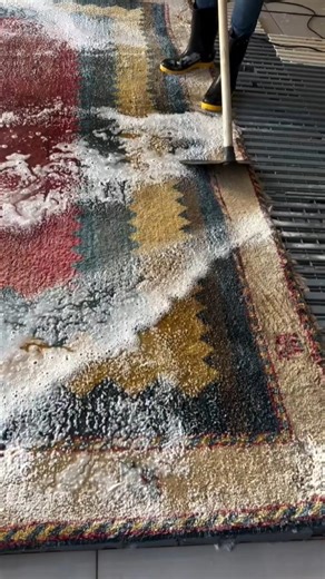 Professional Carpet Washing – Foam Rinsing with Floor Squeegee on Patterned Rug