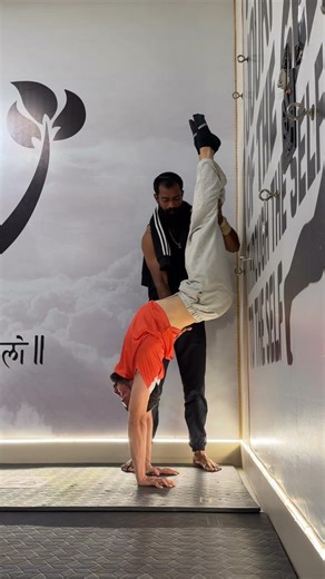 Hollow back handstand through wall support build strength, balance, control daily