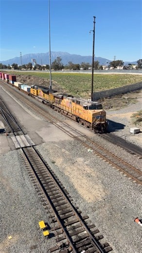 A UP train with a nice crew rolls thru the sweat Colton Yard
