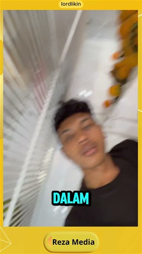 This guy desperately climbs into a store fridge to chill out because of the extreme heat