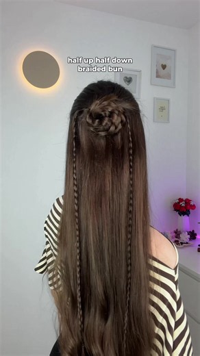 Half up half down braided bun hairstyle