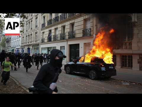 Riot police use tear gas to disperse student protesters in Paris