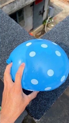 Experiment: Will a water balloon explode if it rolls down a tall building? 💥🎈 #balloon