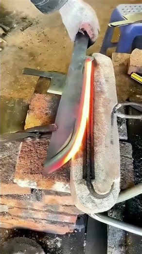 Blacksmith Heats Blade, Quenching Sparks Fly!