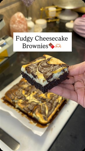 Blissful Bites | Zartaj Fatima on Instagram: "Try these Ultimate Fudgy Cheesecake Brownies🍫👇🏻 For brownie base: 2 eggs, 1/2 cup caster sugar, 1/4 cup brown sugar, 1/2 tsp vanilla, 1/2 cup butter, 200g chocolate, 1/2 cup flour, 1/4 cup cocoa powder, a pinch of salt For cheesecake: 190g cream cheese, 3tbsp sugar, 1/2tsp vanilla, one egg Bake at 160 for 25mins on both rods❤️ . . . #cheesecakebrownies #brownies #fudgebrownies #bakingrecipe #trending"