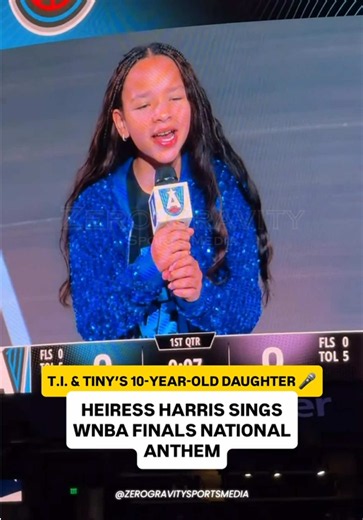 🎤 T.I. & TINY’S DAUGHTER HAS SOME SERIOUS VOCALS! 10-year-old Heiress Harris performed the national anthem before Game 6 of the WNBA Finals between the Atlanta Dream and Golden State Valkyries at State Farm Arena! And the talent clearly runs in the family. ICYMI: * Her father, Atlanta rapper T.I., performed alongside Quavo during Game 3 of the Finals. * Just last week, Heiress performed Whitney Houston’s “Greatest Love of All” at an Atlanta event attended by former President Bill Clinton. * She